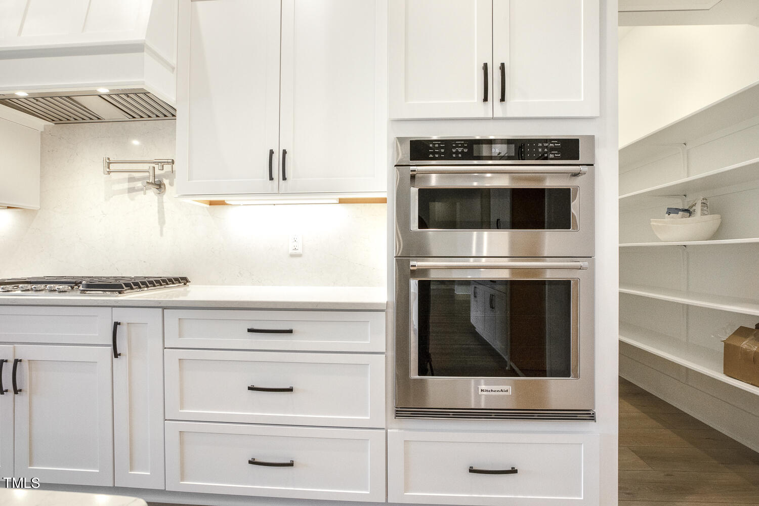 593 Pope Lake Road Angier, NC 27501 - Photo 23 of 48 a stove top oven sitting inside of a kitchen and white kitchen