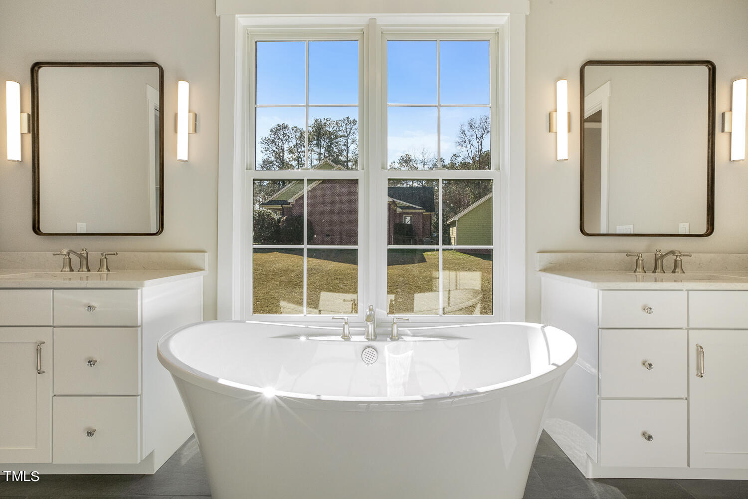 593 Pope Lake Road Angier, NC 27501 - Photo 30 of 48 a bathroom with a sink double vanity and a mirror