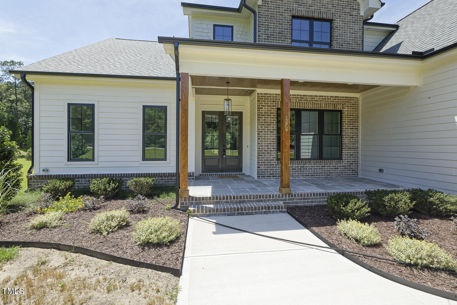 593 Pope Lake Road Angier, NC 27501 - Photo 3 of 48 a front view of a house with garden