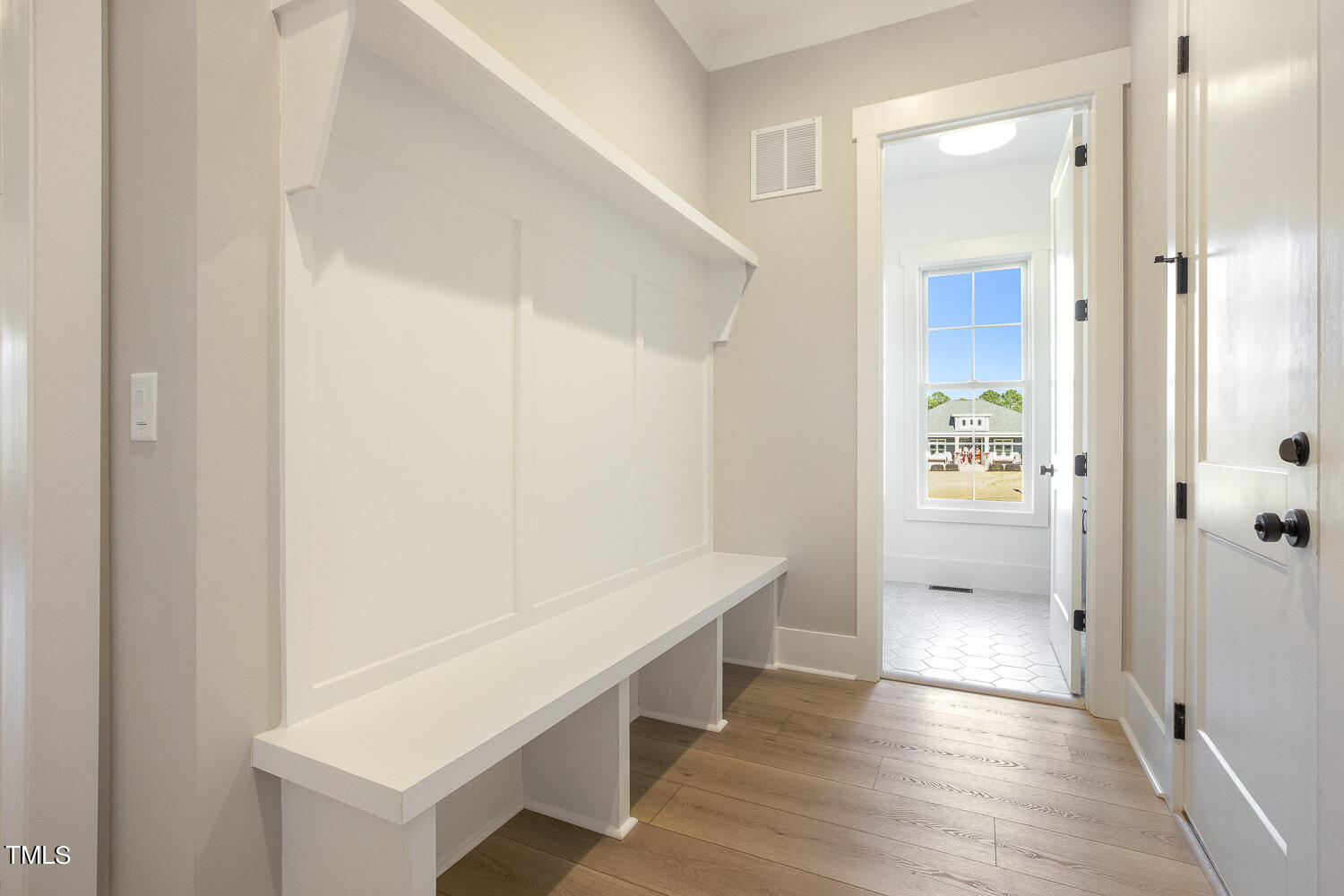 593 Pope Lake Road Angier, NC 27501 - Photo 36 of 48 a view of an empty walk in closet and wooden floor