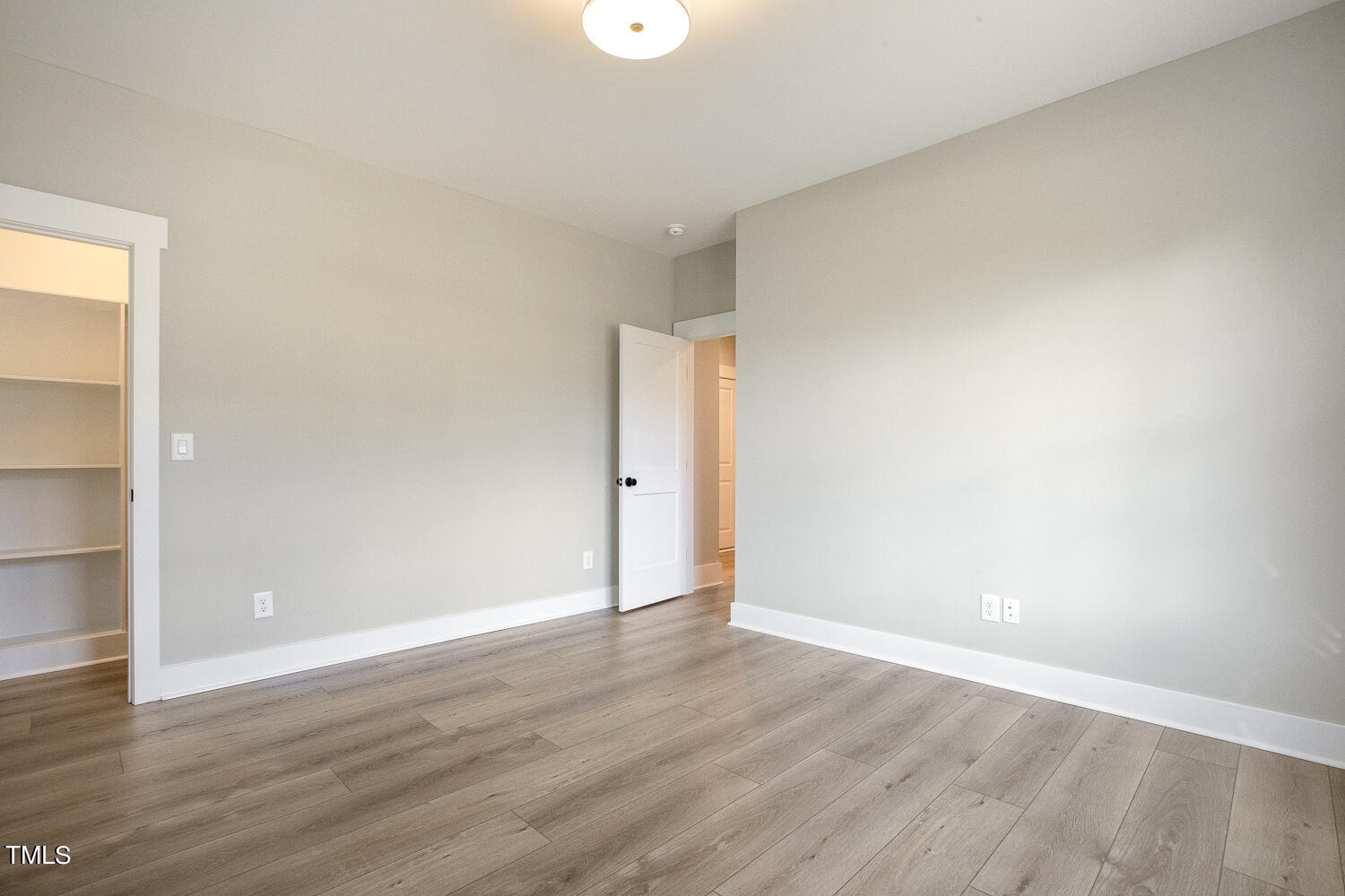 593 Pope Lake Road Angier, NC 27501 - Photo 39 of 48 a view of an empty room with wooden floor