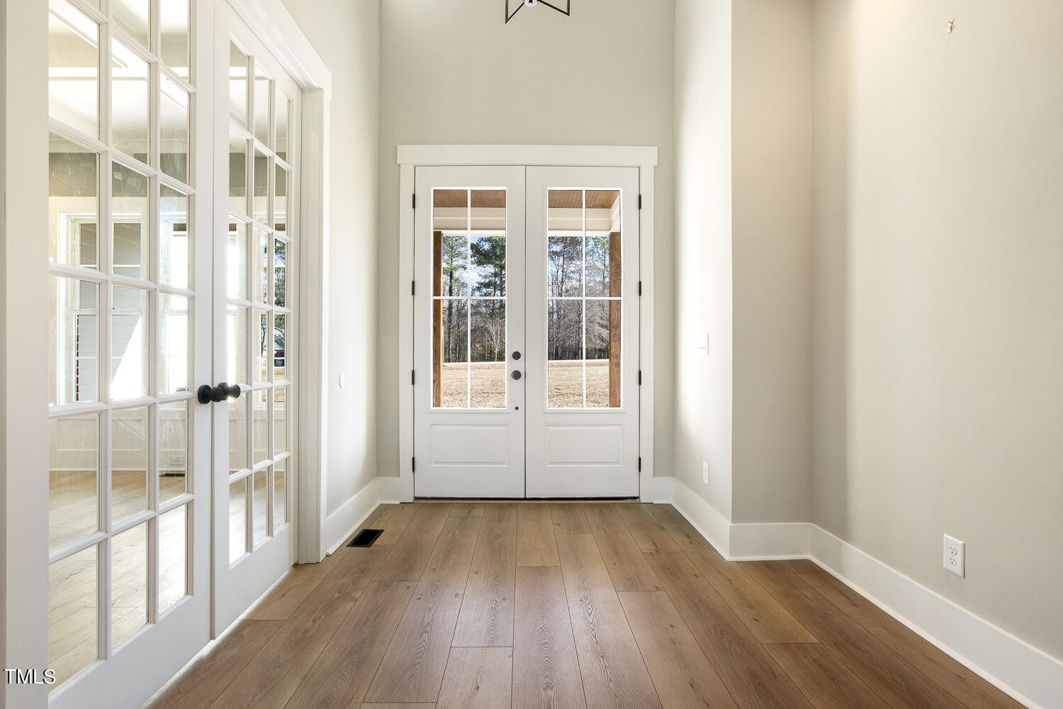 593 Pope Lake Road Angier, NC 27501 - Photo 7 of 48 wooden floor in an empty room with a window