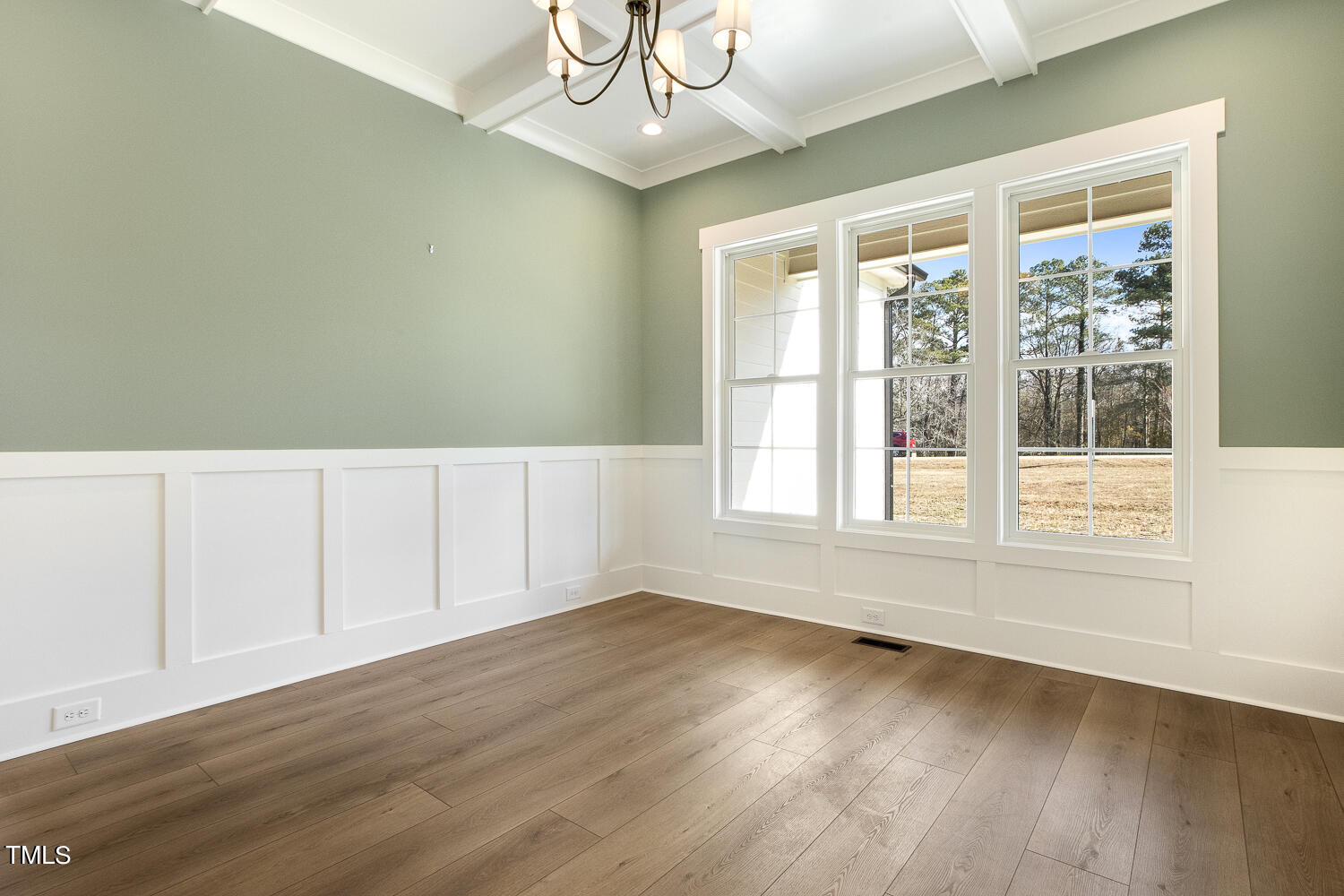 593 Pope Lake Road Angier, NC 27501 - Photo 9 of 48 a view of an empty room with wooden floor and a window