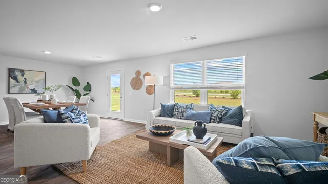 a bedroom with bed and a large window