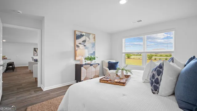 a bedroom with a bed and a couch