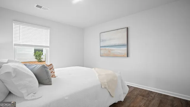 a bedroom with a bed and a closet