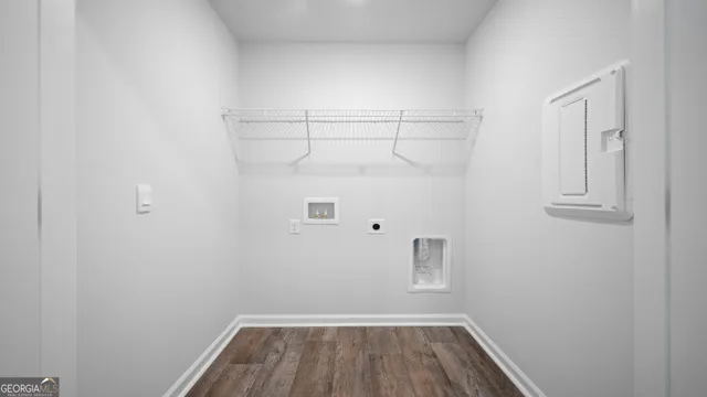 a kitchen with stainless steel appliances granite countertop a refrigerator a stove top oven a sink dishwasher and microwave