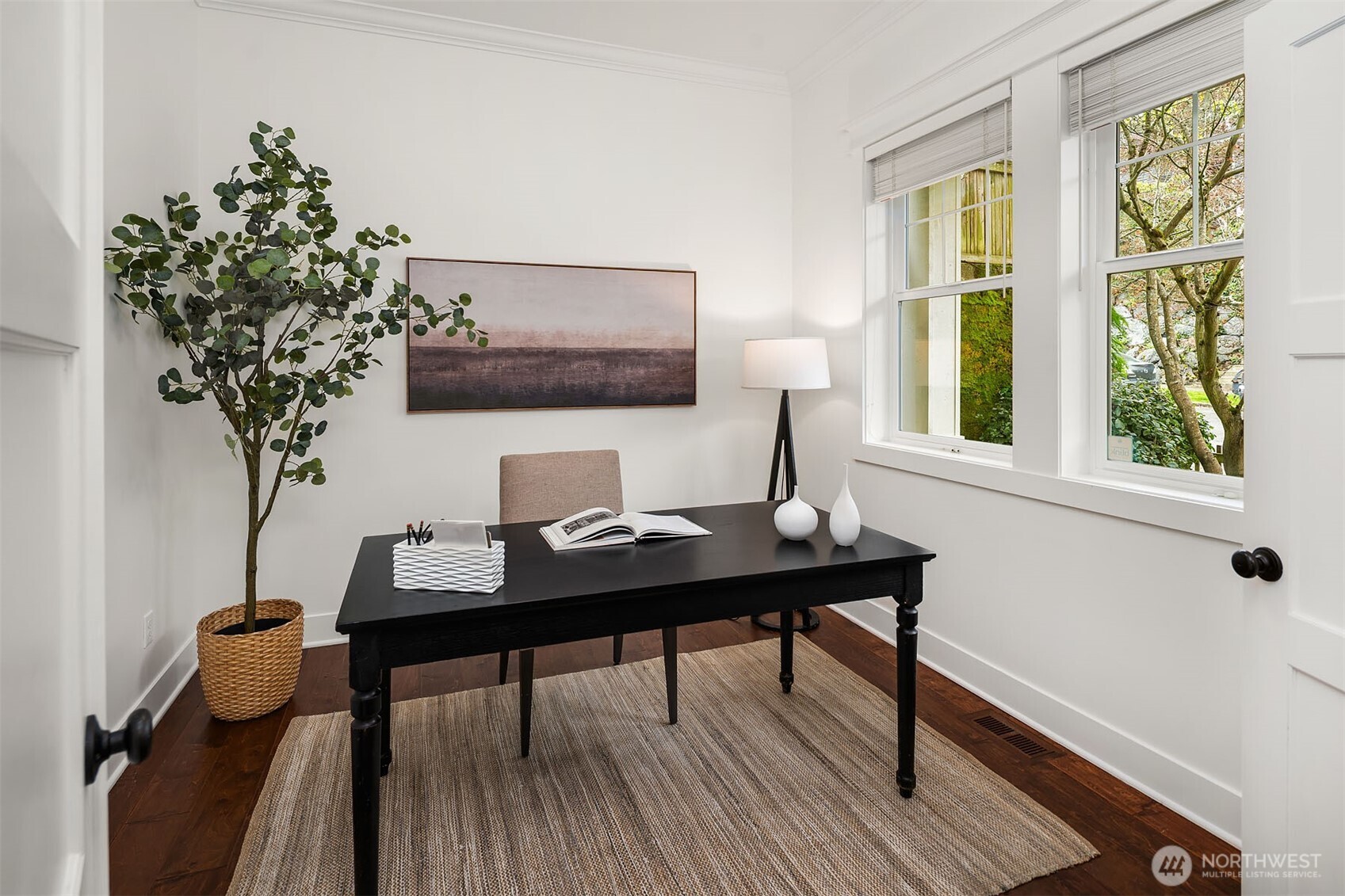 1520 37th Avenue Seattle, WA 98122 - Photo 17 of 35 a view of a workspace with a window and wooden floor
