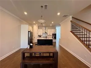 a living room with furniture and a ceiling fan