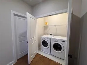 a bedroom with a bed and a television