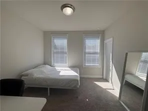 a en suite bathroom with double sink and a mirror