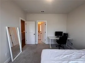 a bathroom with double sink and a mirror