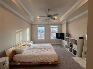 a view of a livingroom with furniture and a ceiling fan