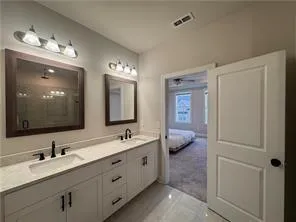 a room with gym equipment and a chandelier