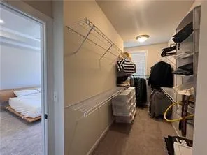 a room with lots of furniture and a window