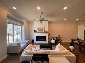 a living room with furniture window and a fireplace