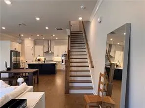 a kitchen with kitchen island a sink stainless steel appliances and cabinets