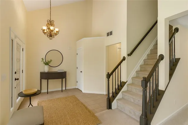 a view of a hallway with paintings on the walls