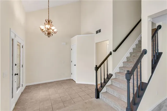 a view of a chandelier and entryway
