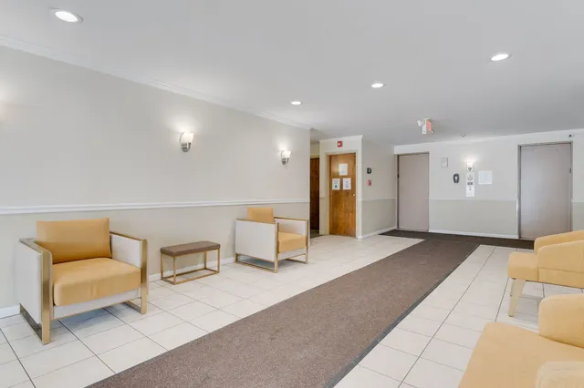 a spacious bedroom with a bed and a couch