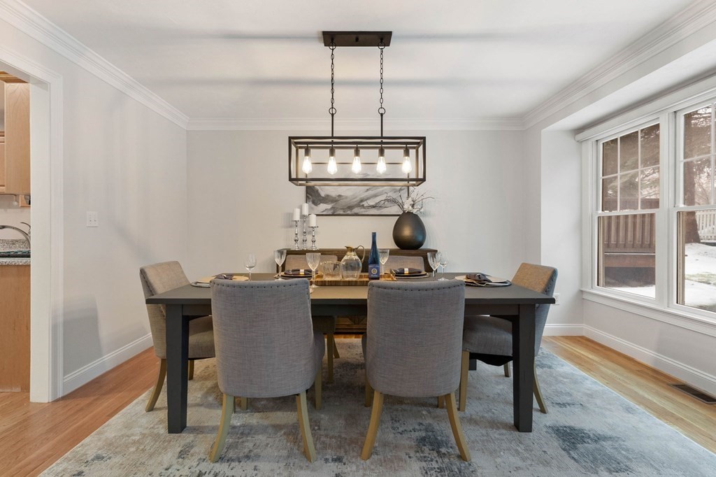 11 Meadowbrook Road, Unit 11 Brookline, MA 02467 - Photo 11 of 42 a view of a dining room with a table and chairs
