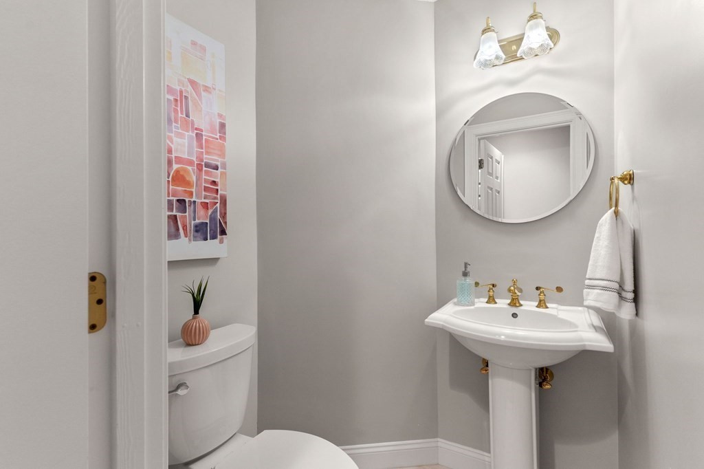 11 Meadowbrook Road, Unit 11 Brookline, MA 02467 - Photo 14 of 42 a bathroom with a sink and mirror