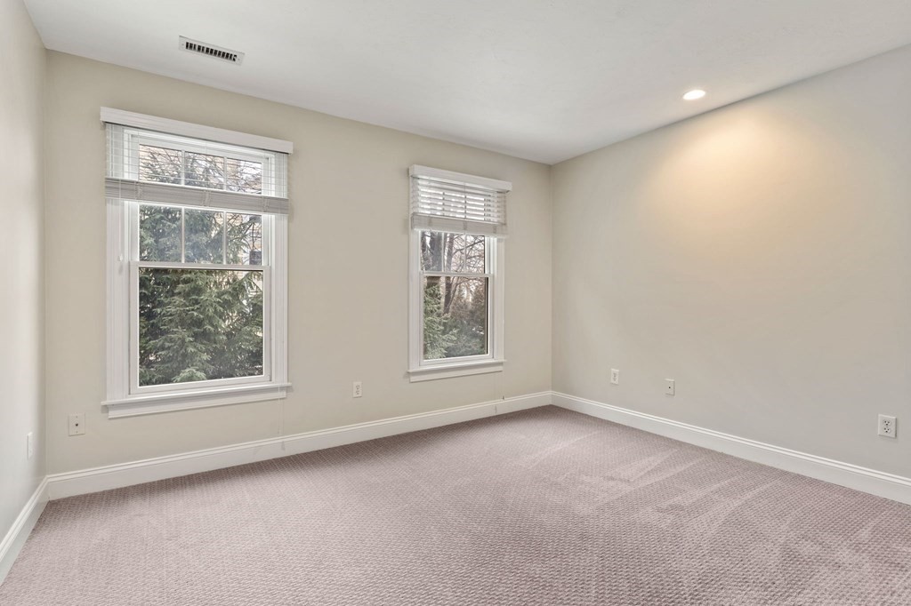 11 Meadowbrook Road, Unit 11 Brookline, MA 02467 - Photo 15 of 42 an empty room with windows