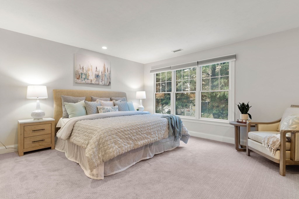11 Meadowbrook Road, Unit 11 Brookline, MA 02467 - Photo 17 of 42 a spacious bedroom with a bed and a large window