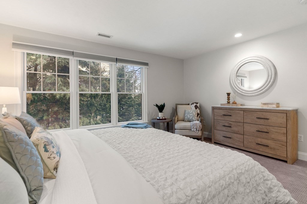 11 Meadowbrook Road, Unit 11 Brookline, MA 02467 - Photo 18 of 42 a bedroom with a bed and a window