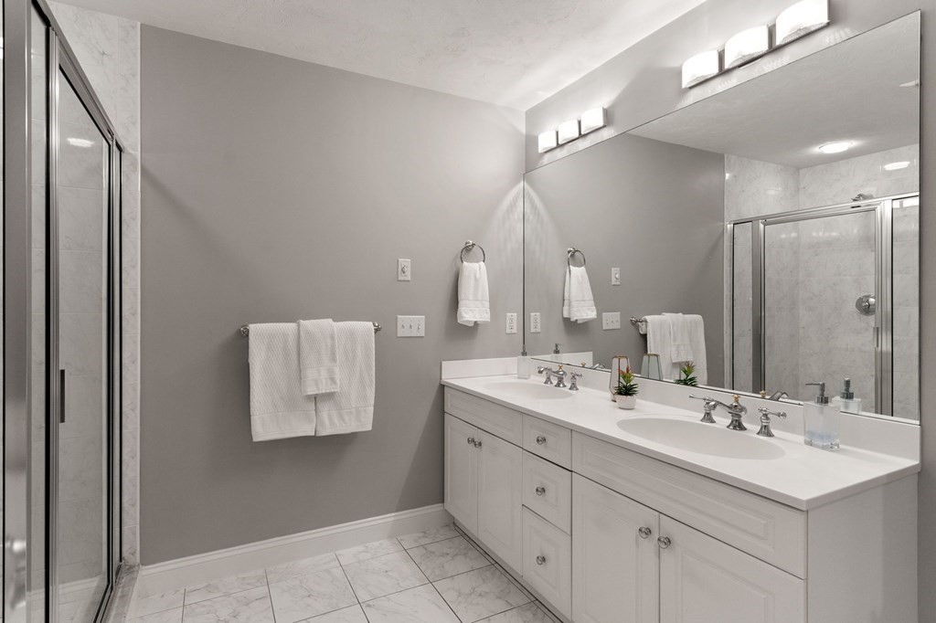 11 Meadowbrook Road, Unit 11 Brookline, MA 02467 - Photo 21 of 42 a bathroom with a double vanity sink mirror and
