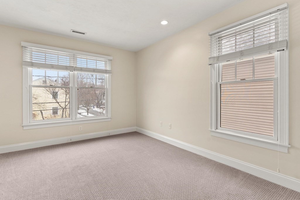 11 Meadowbrook Road, Unit 11 Brookline, MA 02467 - Photo 25 of 42 an empty room with windows