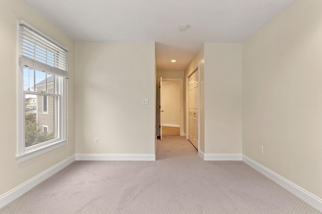 11 Meadowbrook Road, Unit 11 Brookline, MA 02467 - Photo 26 of 42 a view of an empty room with a window