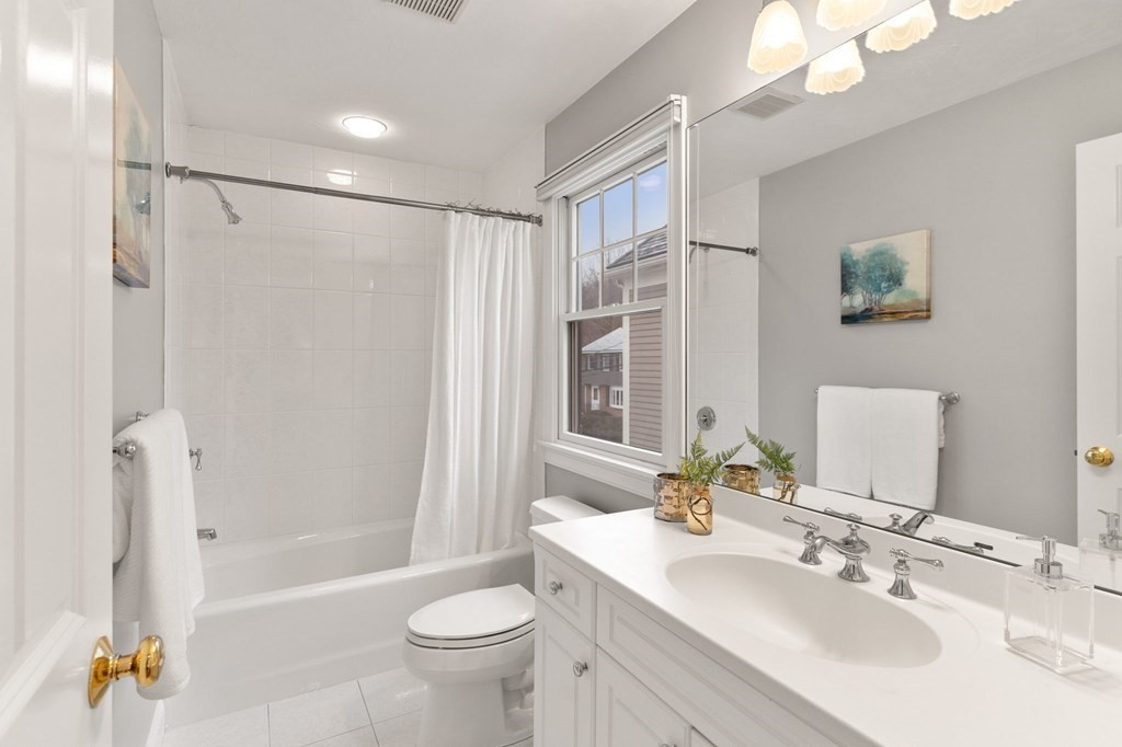11 Meadowbrook Road, Unit 11 Brookline, MA 02467 - Photo 27 of 42 a bathroom with a sink toilet and shower