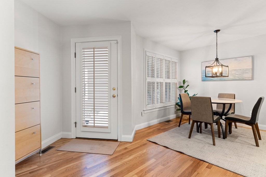 11 Meadowbrook Road, Unit 11 Brookline, MA 02467 - Photo 3 of 42 a view of a dining room with furniture window and wooden floor