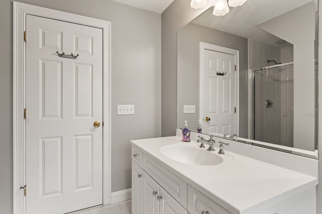 11 Meadowbrook Road, Unit 11 Brookline, MA 02467 - Photo 31 of 42 a bathroom with a sink vanity tub and shower