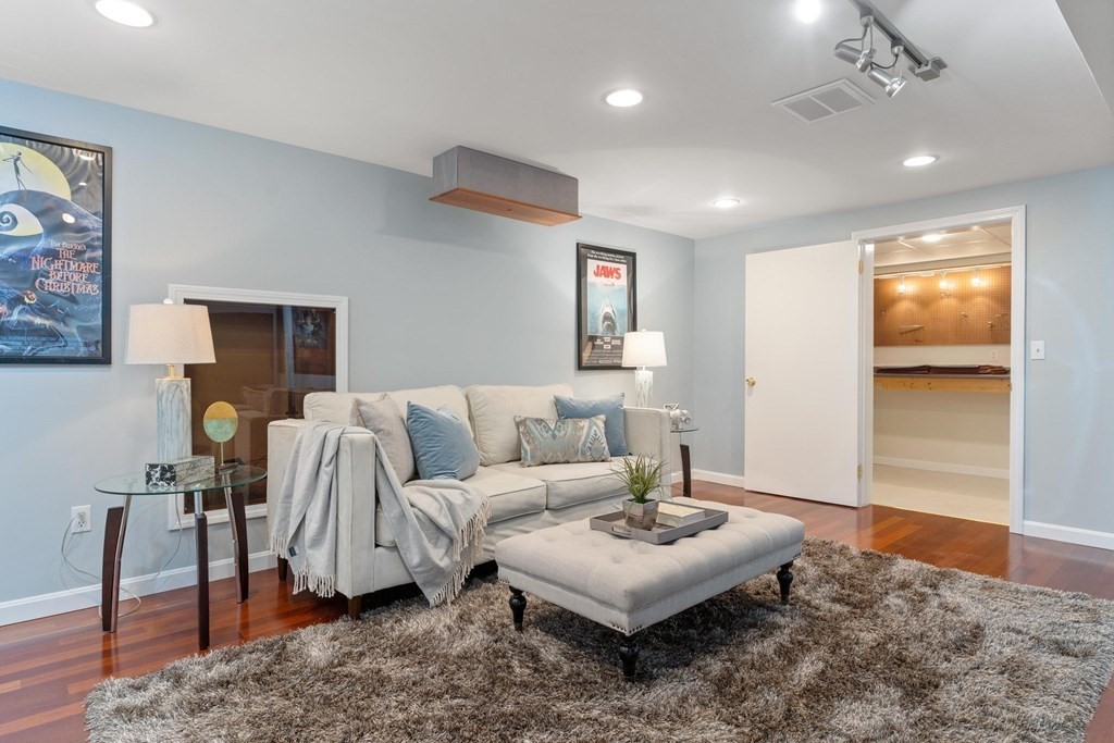 11 Meadowbrook Road, Unit 11 Brookline, MA 02467 - Photo 36 of 42 a living room with furniture and a wooden floor