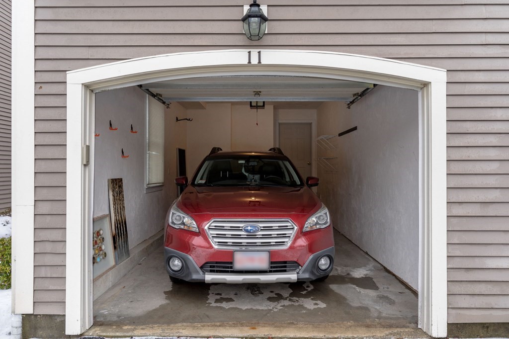 11 Meadowbrook Road, Unit 11 Brookline, MA 02467 - Photo 37 of 42 a car parked in front of a house