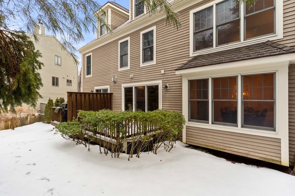 11 Meadowbrook Road, Unit 11 Brookline, MA 02467 - Photo 40 of 42 a front view of a house with a yard