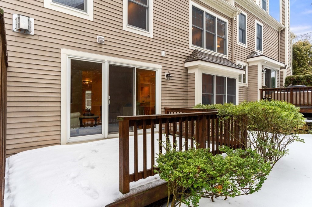 11 Meadowbrook Road, Unit 11 Brookline, MA 02467 - Photo 41 of 42 a view of a house with a small yard and flower plants