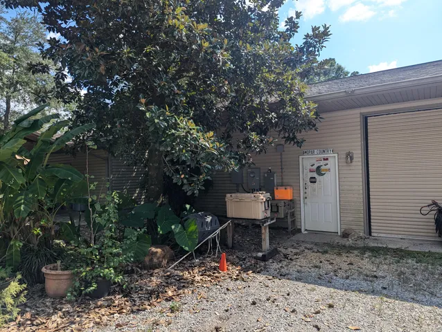 a view of a backyard with sitting area