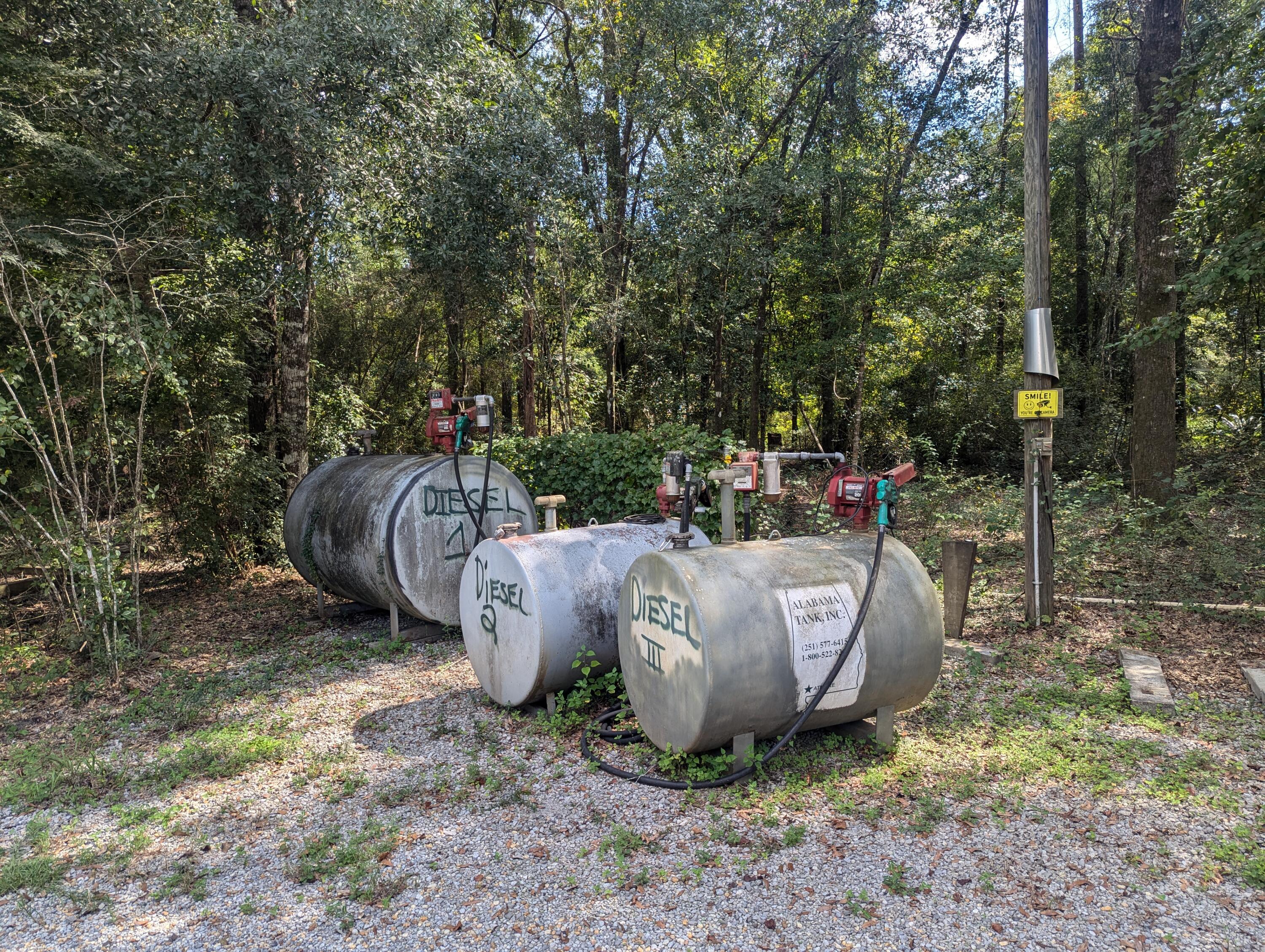 4964 Retreat Inlet Baker, FL 32531 - Photo 7 of 28 a view of a backyard that has a fountain and a table and chairs