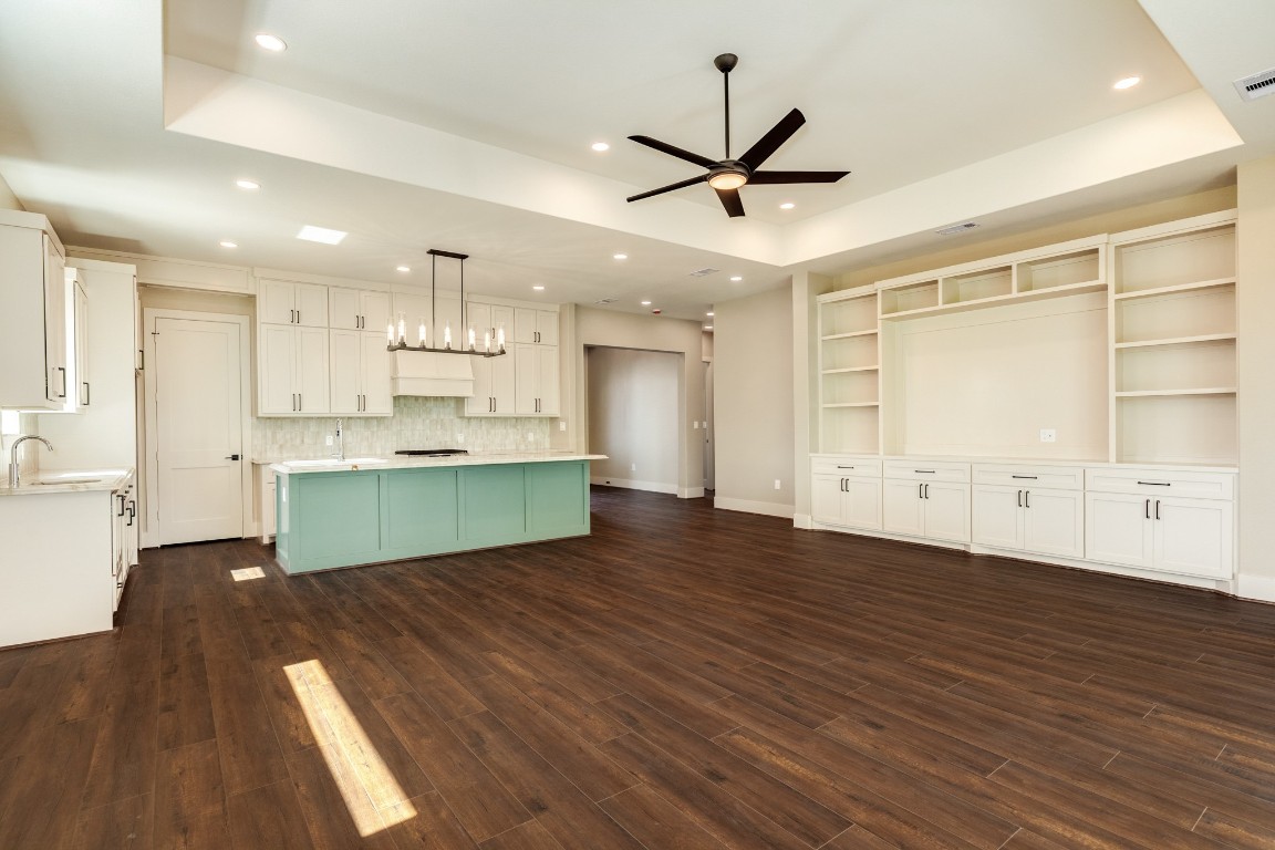 1737 Flintlock Court Angleton, TX 77515 - Photo 17 of 47 Tons of built ins surround the living room provide space for your library or your lifestyle photos. An open concept allows for flexibilty for anyone.