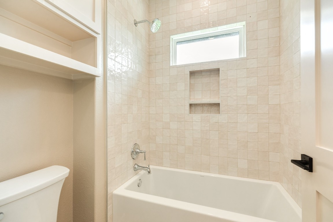 1737 Flintlock Court Angleton, TX 77515 - Photo 43 of 47 This timeless tile elevates the look of this space. All colors were desinged and thoughtfully curated by an interior designer.