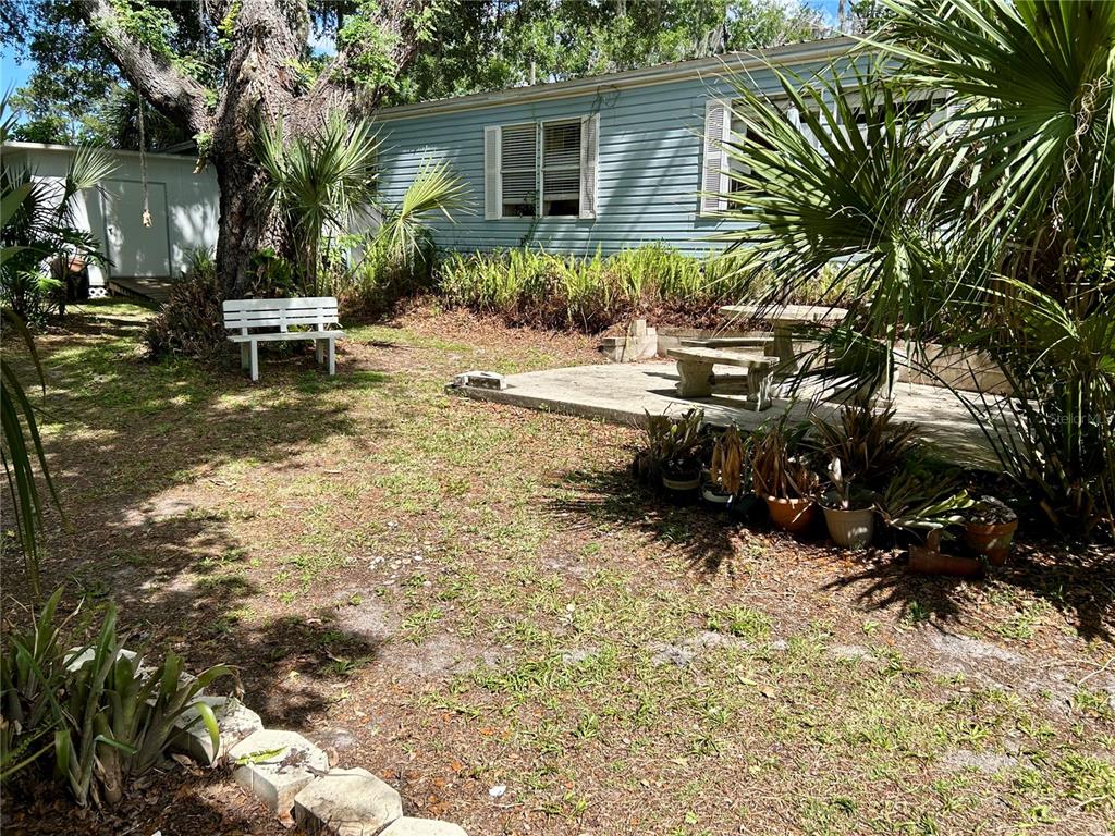 25646 Bass Road Astor, FL 32102 - Photo 41 of 48 a view of a house with backyard and sitting area