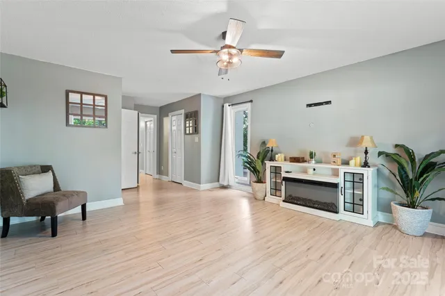 a living room with furniture and a potted plant