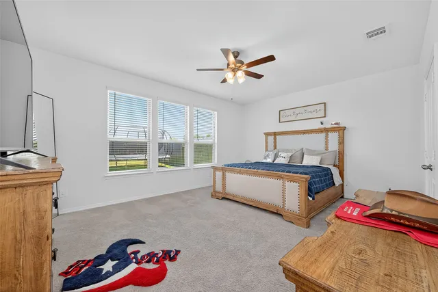 a bedroom with furniture and a window