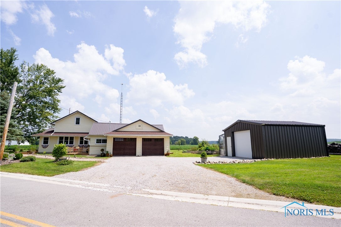 30702 Weichman Road Holgate, OH 43527 - Photo 50 of 50 Additional out building can be used for a 3rd car garage space, current owner uses as a work shop with a attached small greenhouse~