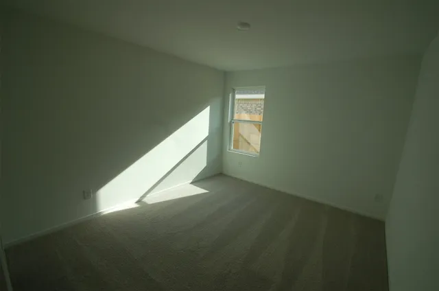 a view of an empty room and window
