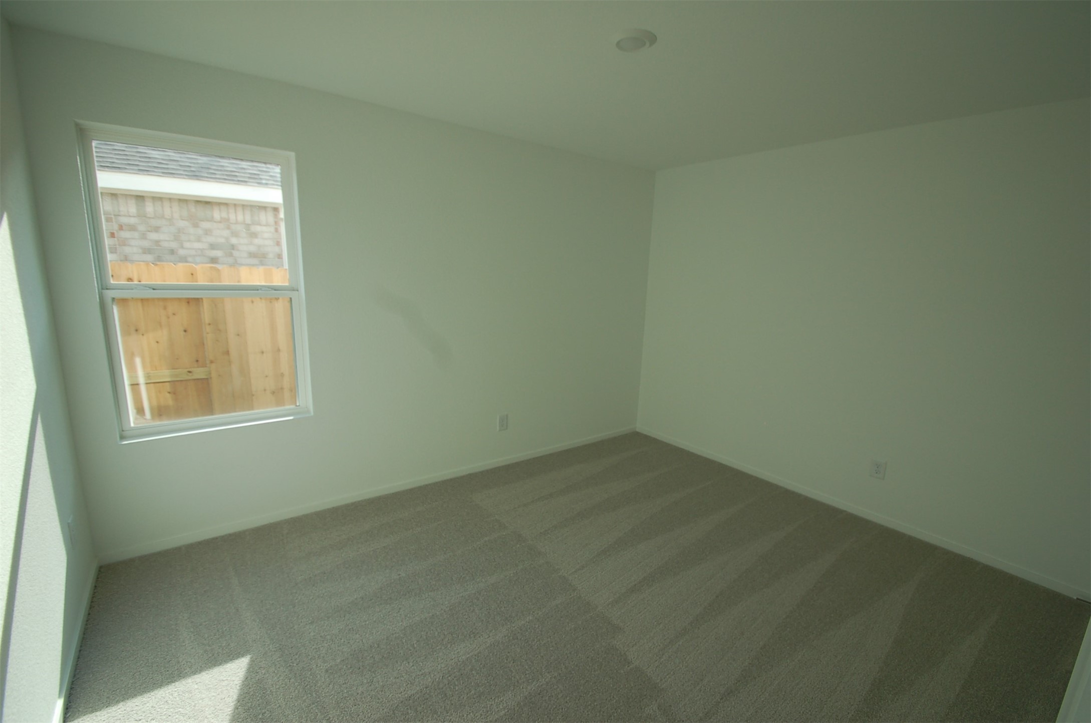 16130 Rustic Prairie Hockley, TX 77447 - Photo 12 of 21 an empty room with a window