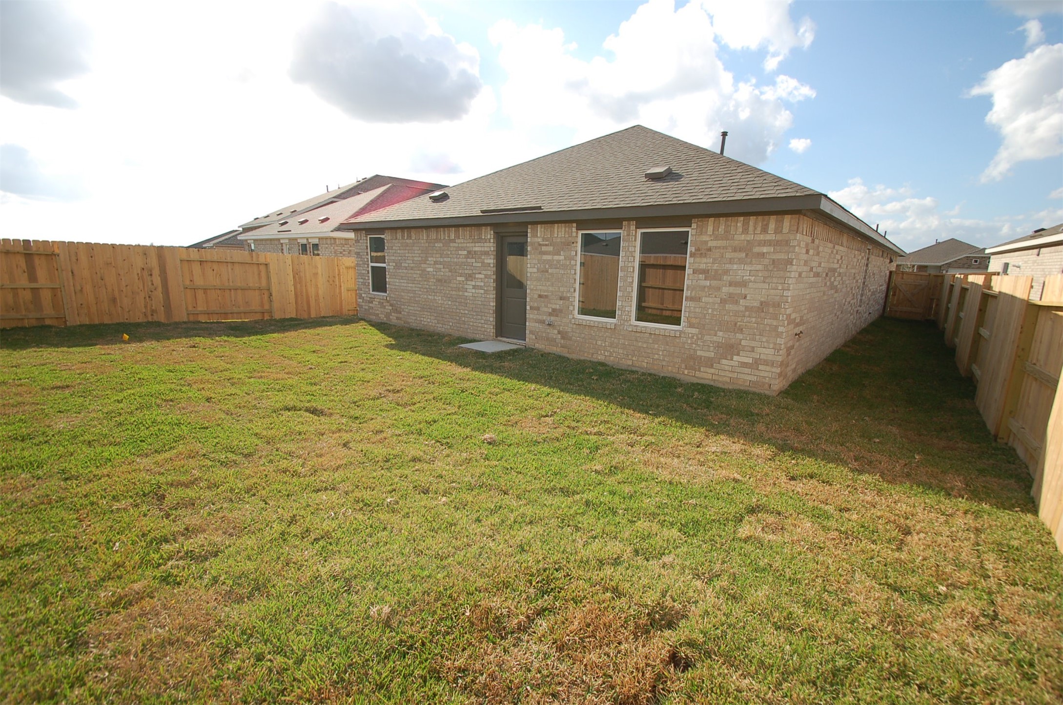 16130 Rustic Prairie Hockley, TX 77447 - Photo 20 of 21 a front view of a house with a garden
